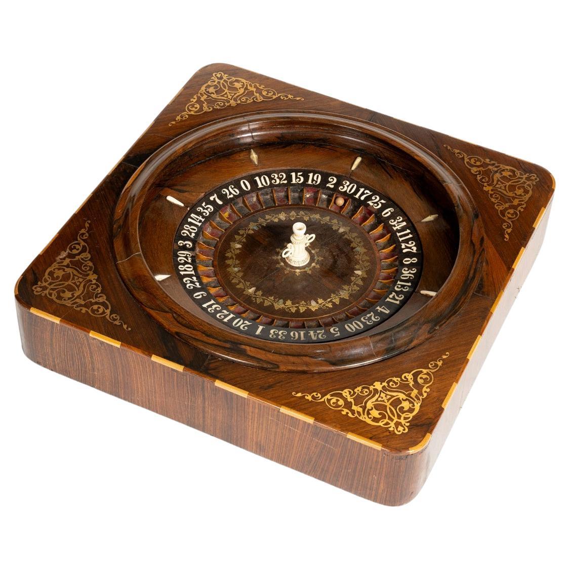 A Walnut And Marquetry Inlaid Roulette Wheel, American, Circa 1900 en vente