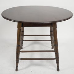 Aesthetic Movement Walnut centre table with incised circular details to the legs