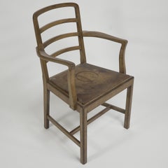 Heals attr, A walnut desk chair or armchair with a rounded top and ladder back.