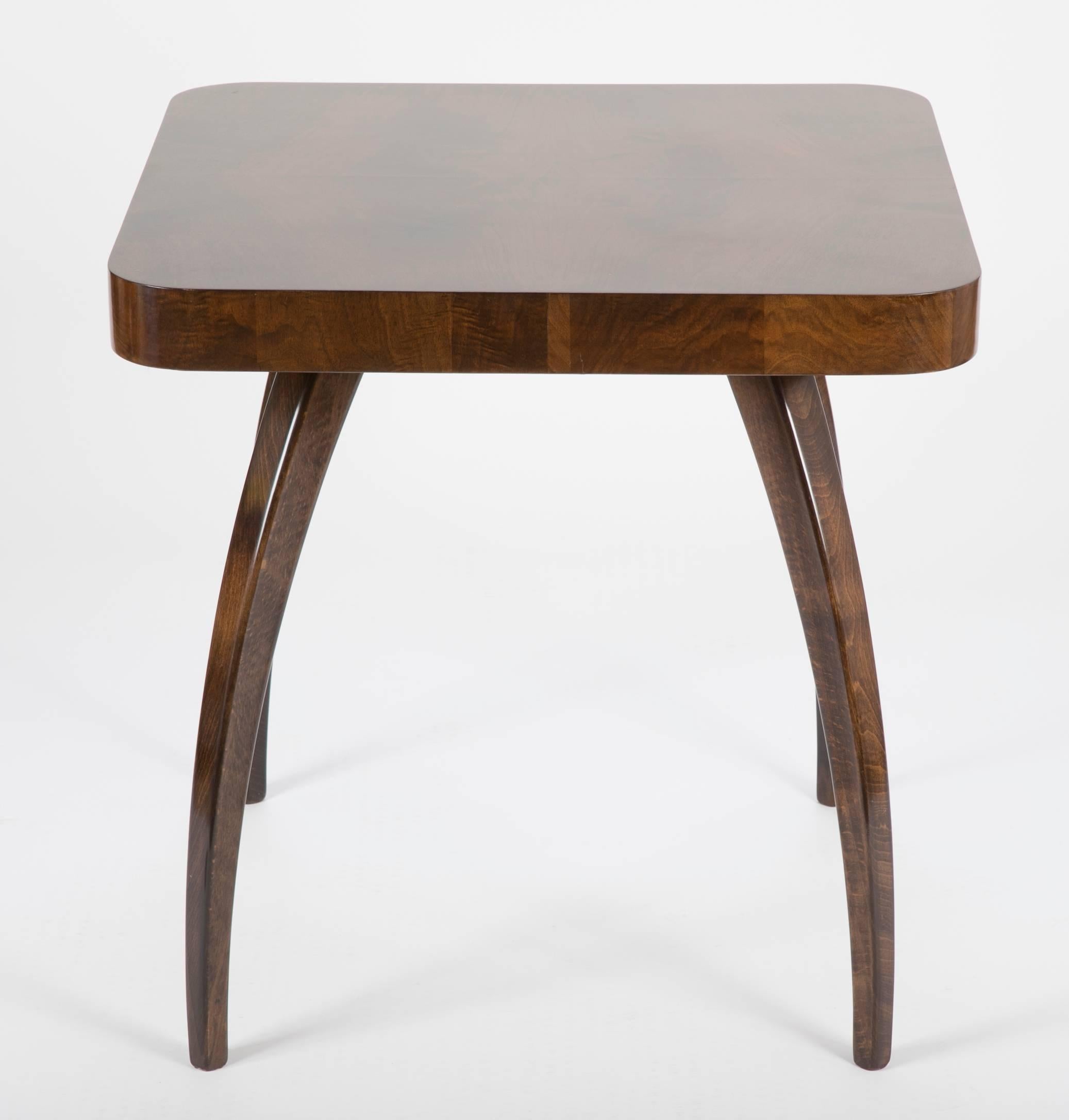 A walnut end table designed by Jindrich Halabala, produced by Zavody Brno, Czech Republic, circa 1930s.