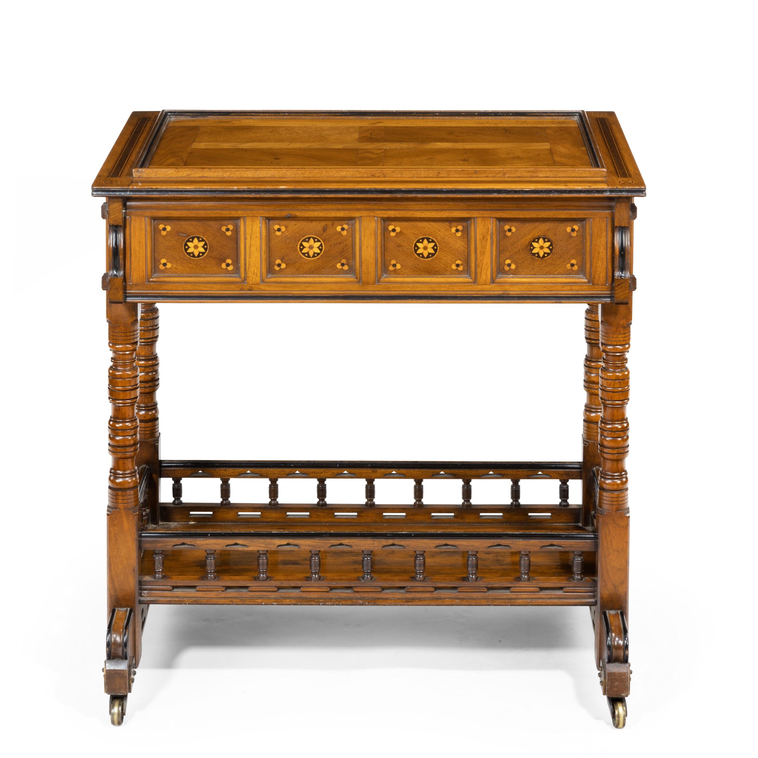 A walnut side table/jardinière by Gillows, probably after Augustus Pugin, the rectangular top lifting out to reveal a brass lining (replaced) for planting, raised upon turned legs enclosing a galleried shelf above crossbars with the original