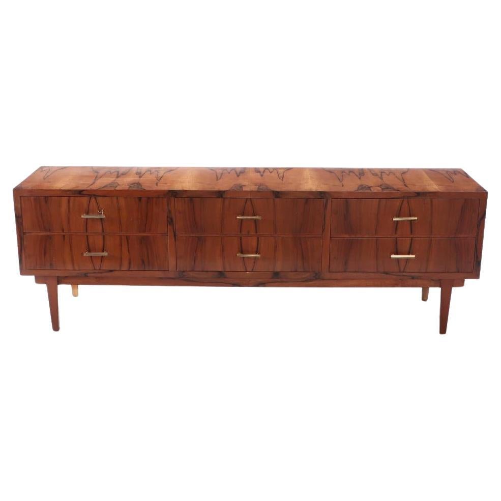 A walnut six drawer dresser circa 1960 with exotic wood grain resembling a tiger