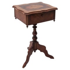 A walnut thread table, from around 1870.