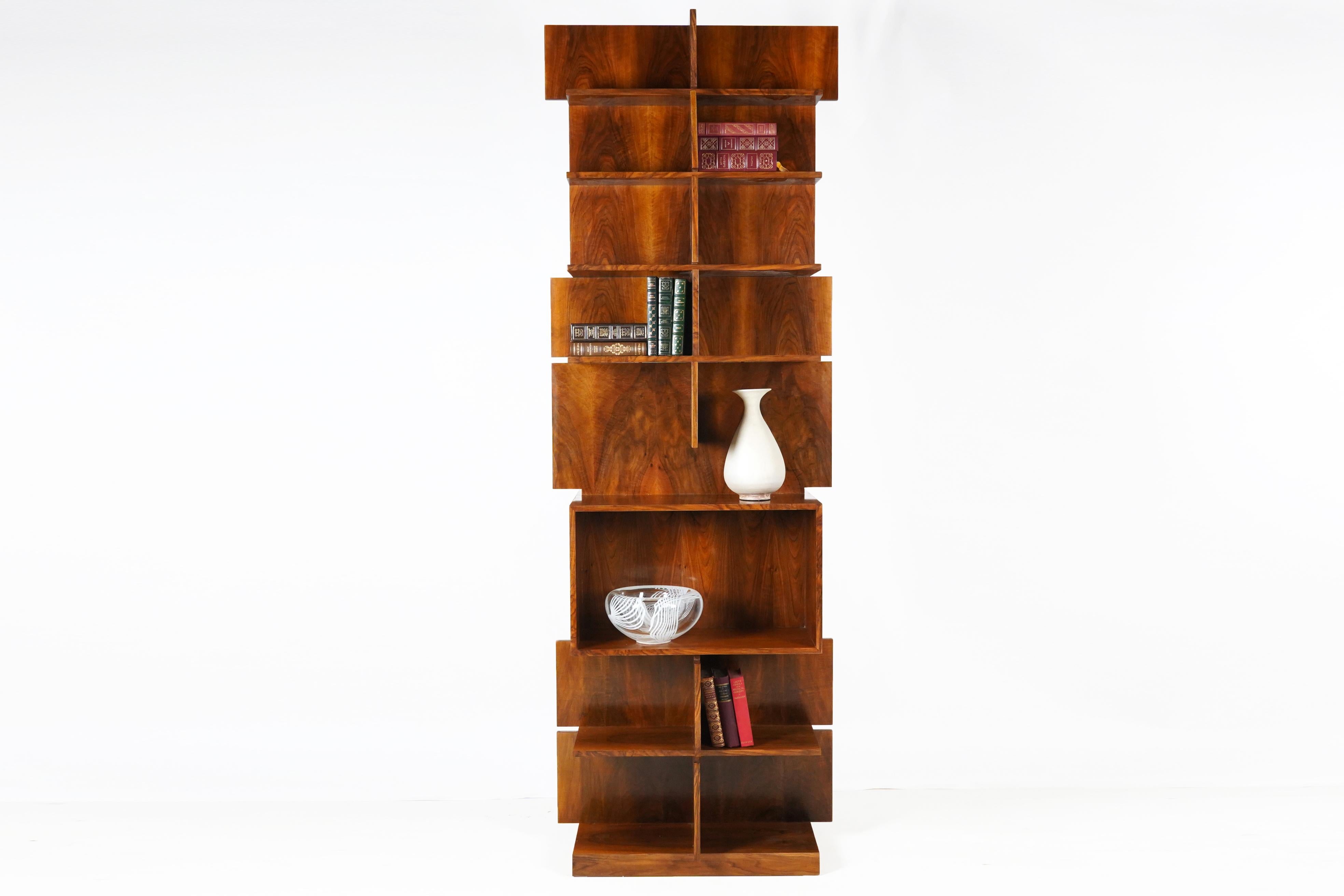 This vintage bookshelf is made from Hungarian walnut veneers, lightly finished in French polish. Hungarian designs of the Art Deco  period are less well known than French ones but were highly-esteemed in Central Europe. Budapest was always a design