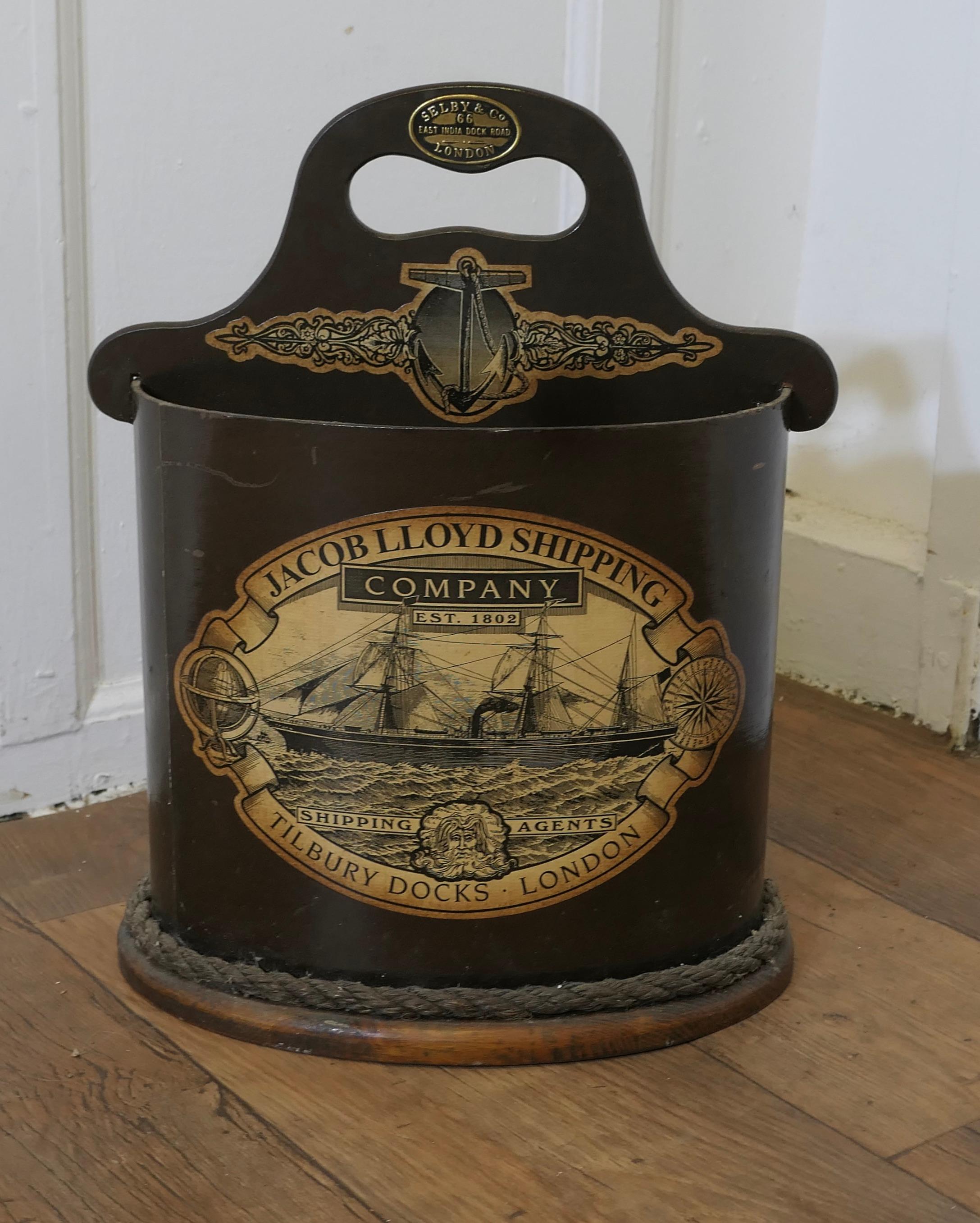 A Waste Paper Basket on a Nautical Theme

The basket is made in wood with a rope edging, it has the advertising plaque for SELBY & C0 the at the top of the handle and a Label for Lloyds Shipping on the front, the bucket gas 2 compartments and it is