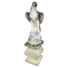 A weathered Stone Statue of Eagle on Plynth