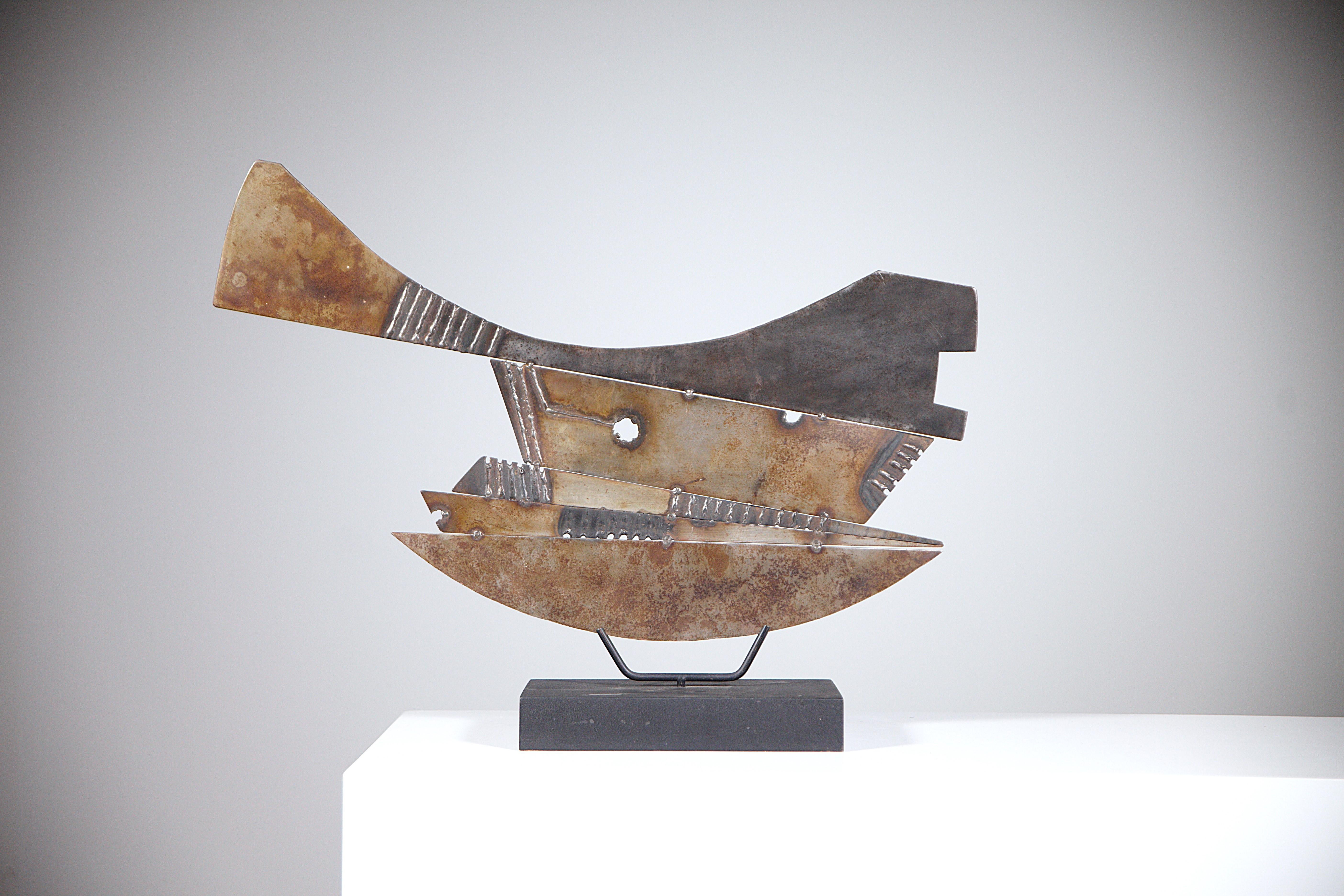 A welded iron sculpture by Guillaume Lanoux.

France 1988. Documented.

Wooden base.

Incredible patina of the metal.

