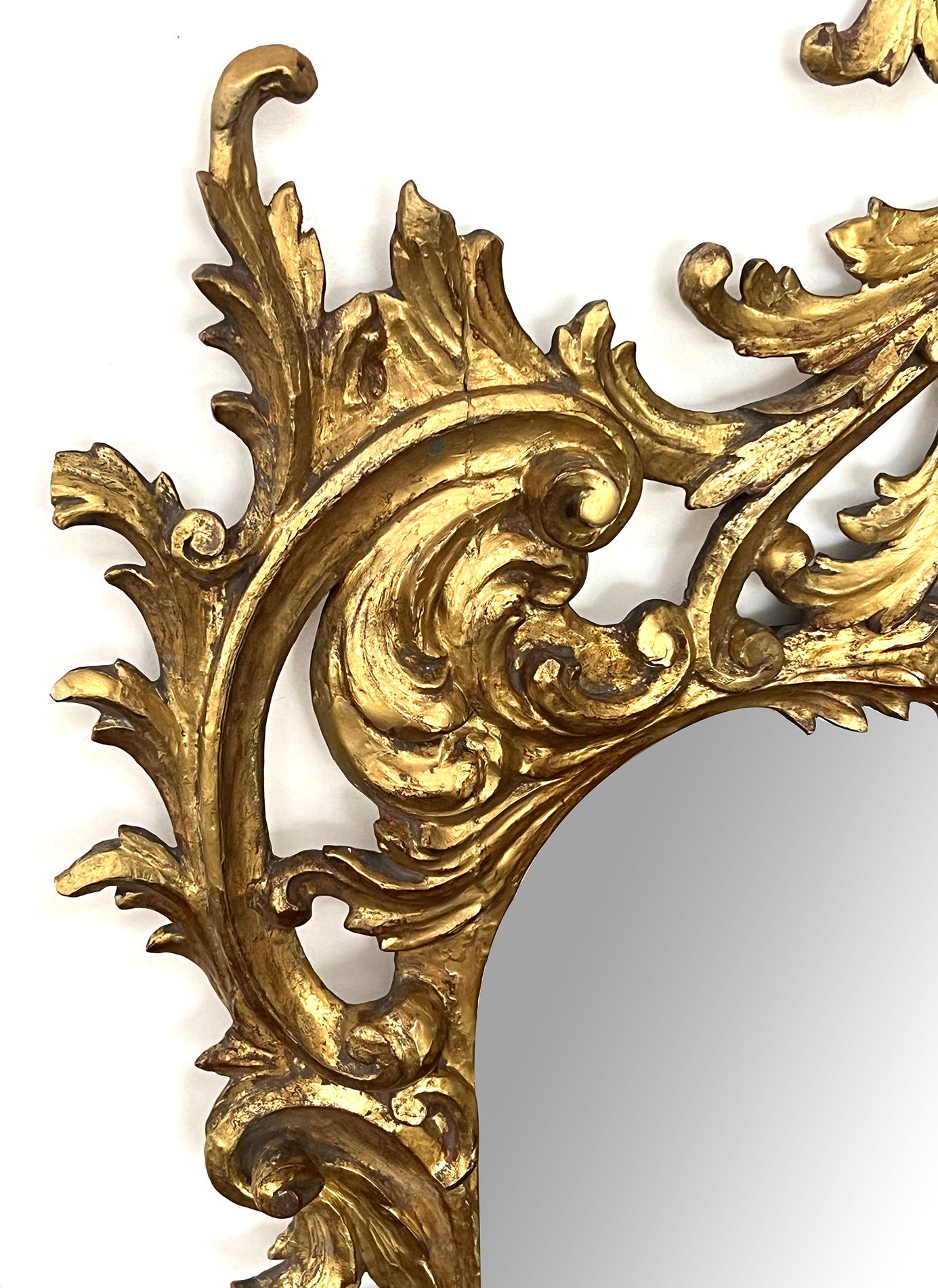 Rococo Revival A Well-Carved French Rococo Style Giltwood Wall Mirror with Exuberant Crest For Sale