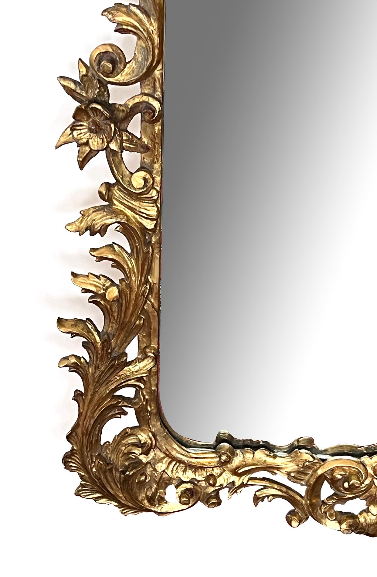 A Well-Carved French Rococo Style Giltwood Wall Mirror with Exuberant Crest In Good Condition For Sale In San Francisco, CA