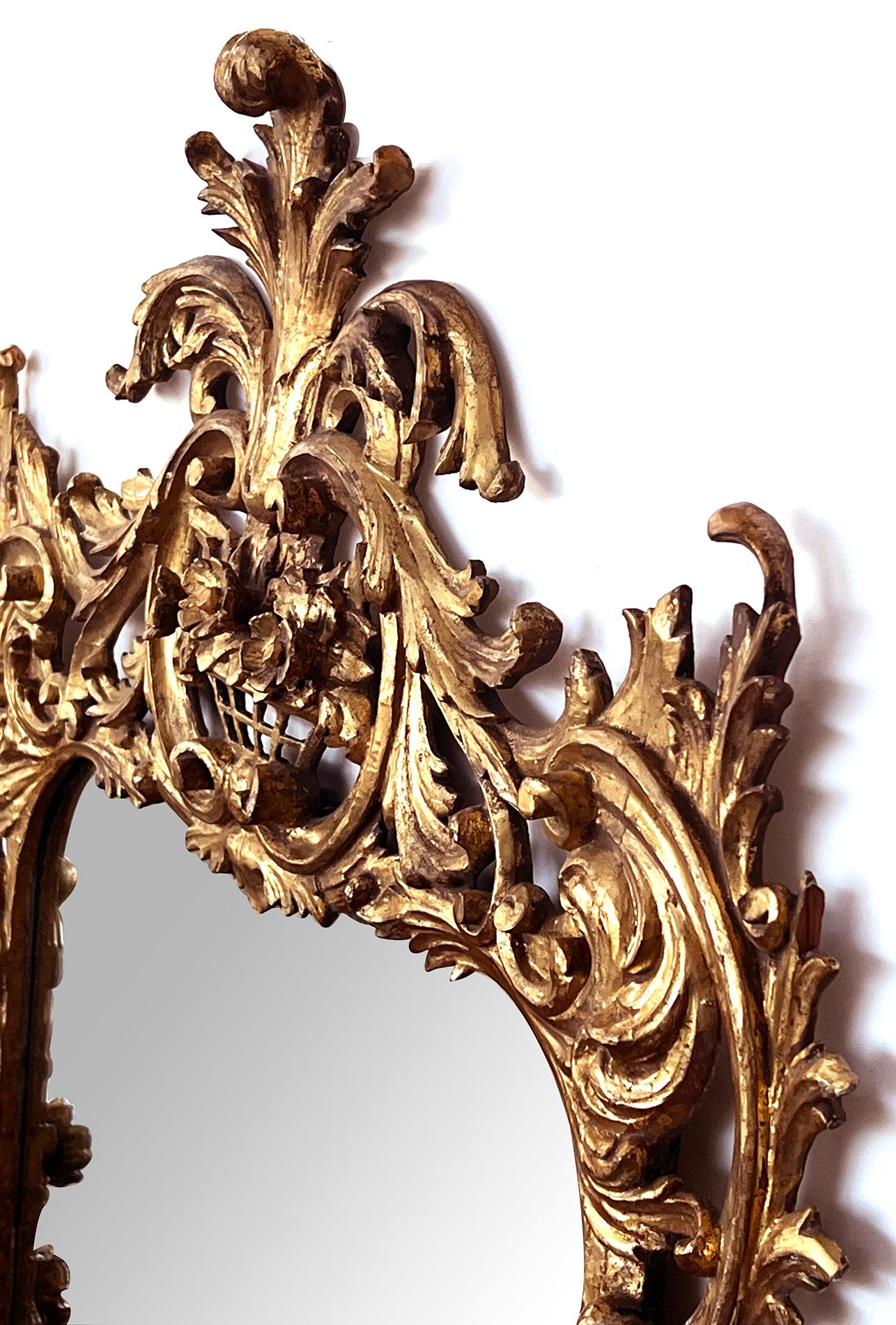 A Well-Carved French Rococo Style Giltwood Wall Mirror with Exuberant Crest For Sale 1