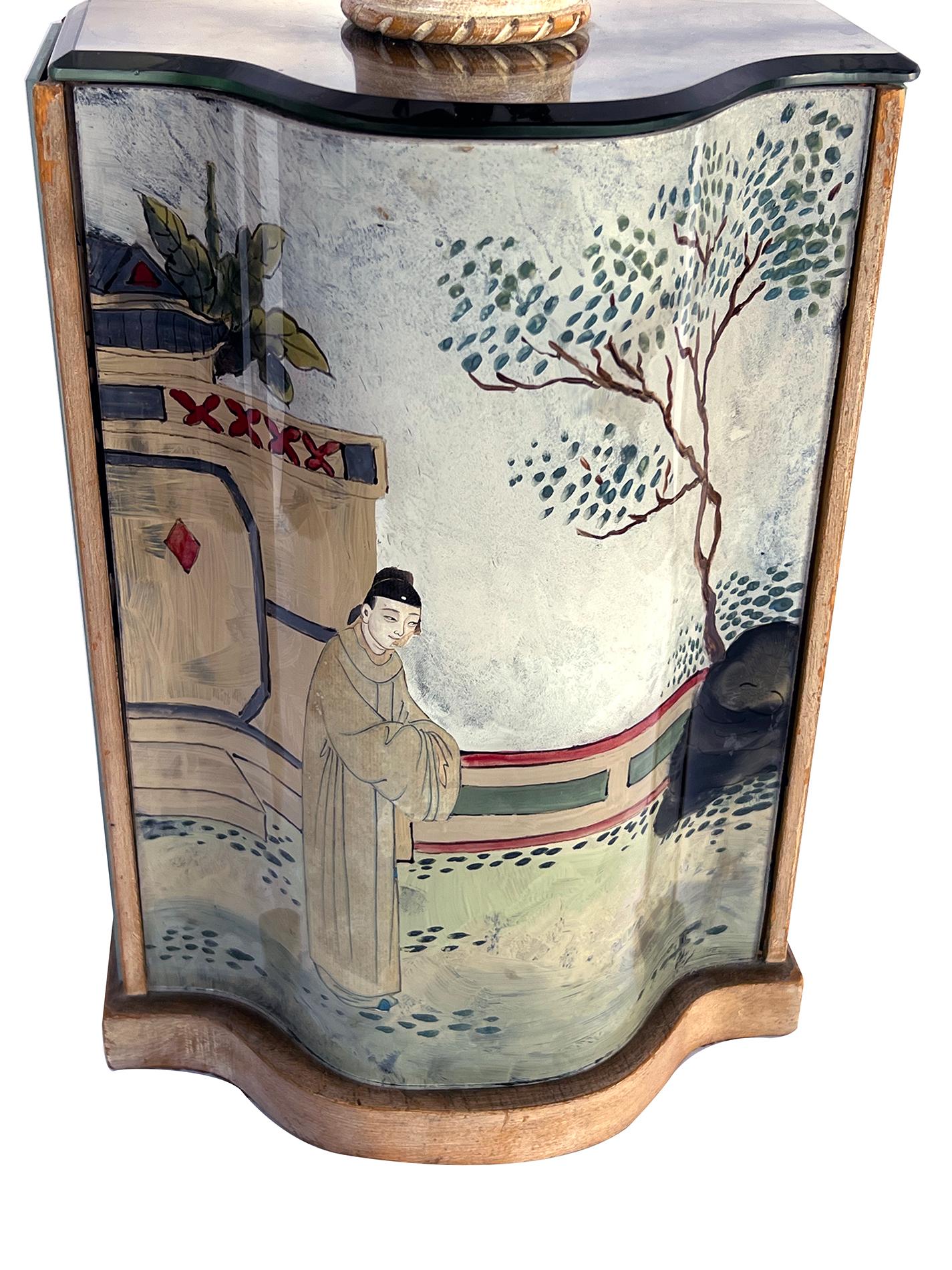the shaped lamp with slumped glass mirrored panels; the front panel with a Chinoiserie reverse-painted scene; all resting on a wooden base