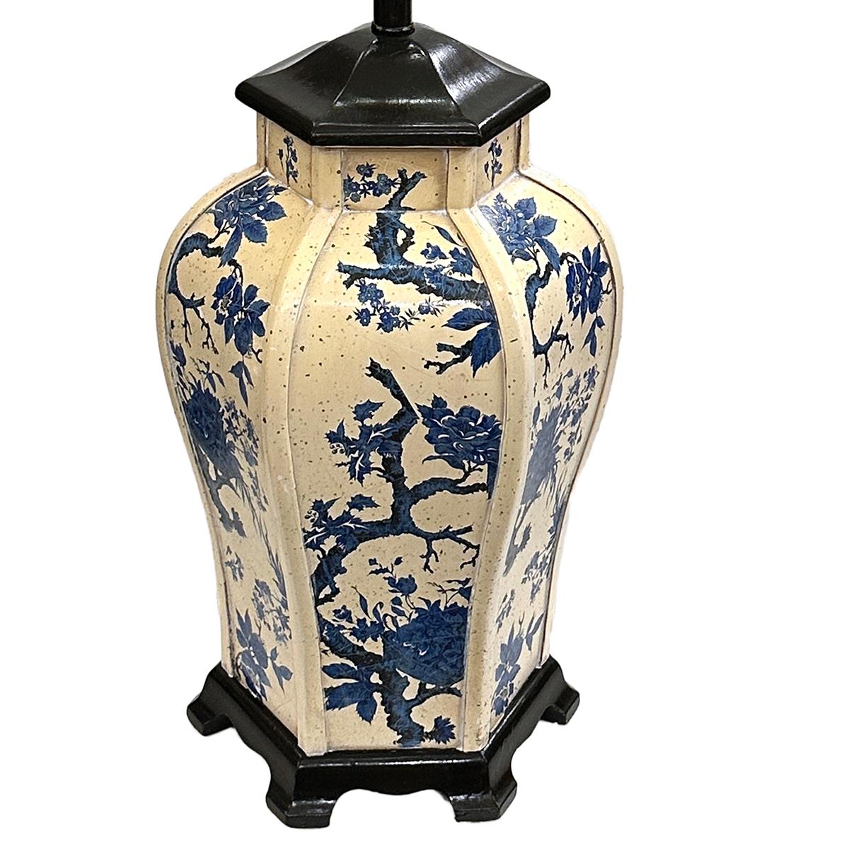 An English circa 1950's Chinoiserie lamp with floral motif.

Measurements:
Height of body: 19