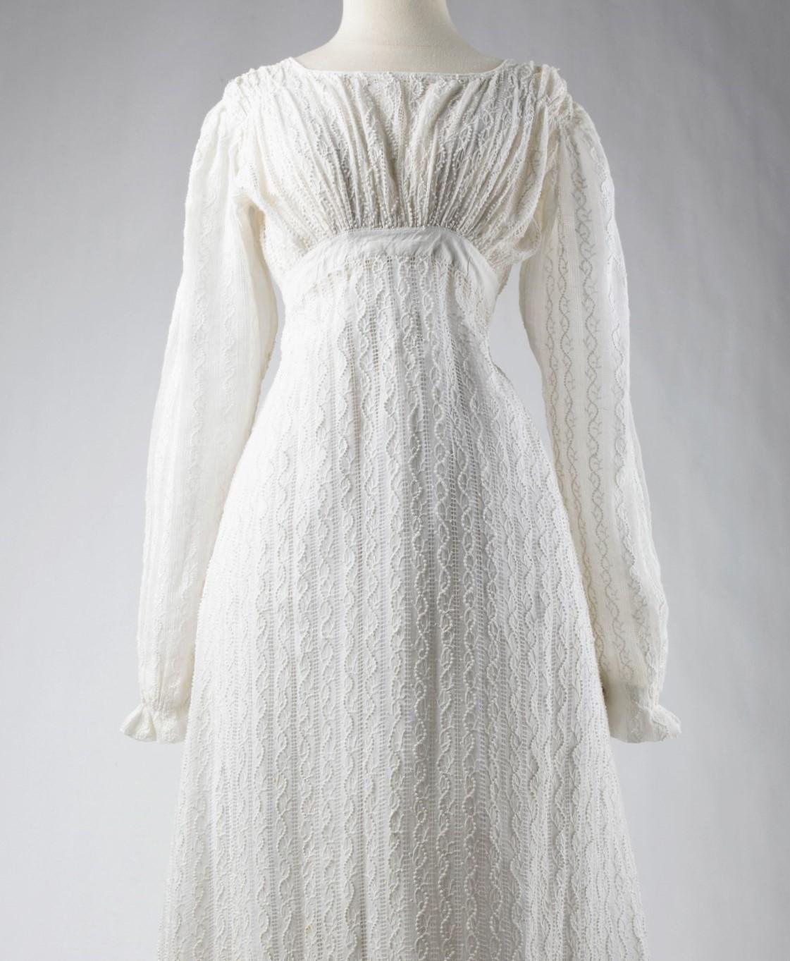 Circa 1816-1818
France
A collectible Museum quality gown. A white cotton embroidery day dress with stripes effect dating from the Première Restauration under Louis XVIII. High-waisted dress, boat neckline, gathered at the waist and shoulders, long