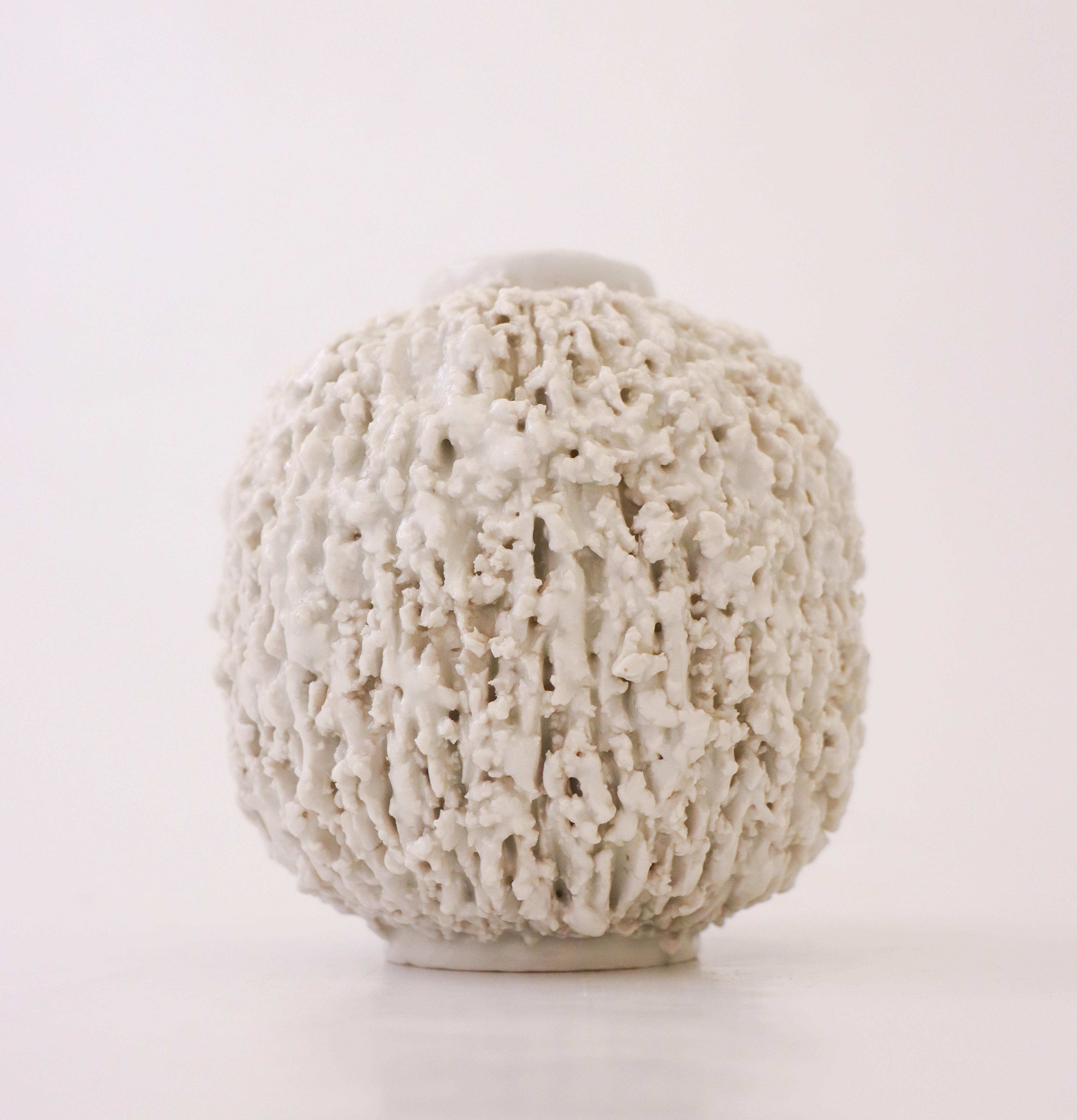 A white Hedgehog-vase designed by Gunnar Nylund at Rörstrand. It is 11 cm (4.4