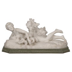 Eine Figurengruppe aus weißem Marmor mit Venus und Amor von Henri Weigele