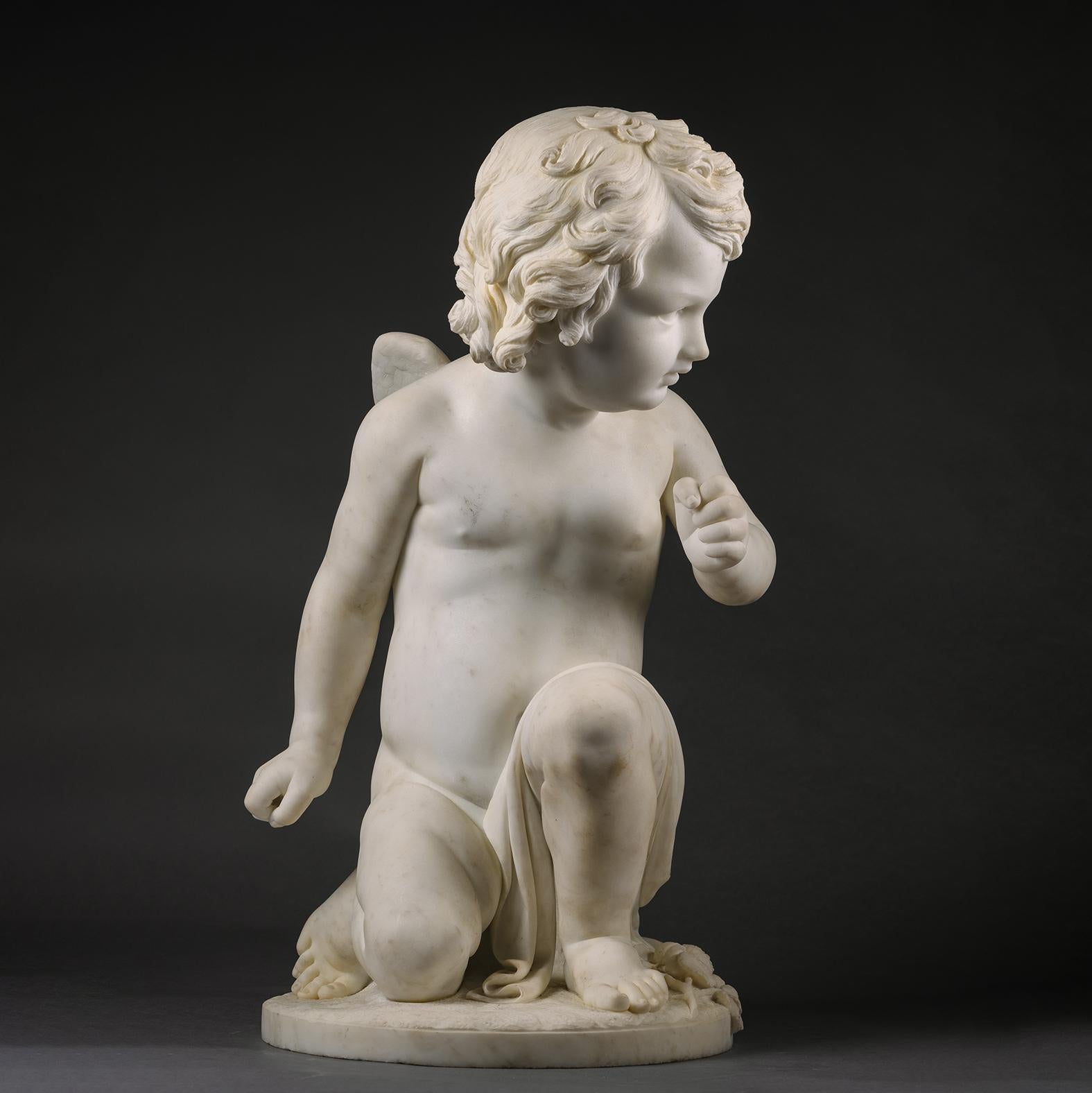 A Fine White Marble Figure of a Kneeling Cherub, By Pio Fedi.

Signed to the base 'Pio Fedi Faceva'.

Italian, Circa 1860.

Pio Fedi (1815-1892) was an Italian sculptor working in the nineteenth century with a studio in Florence at 89 Via de