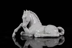 A White Meissen Porcelain Figure of a Reclining Foal/Horse by Willi Münch-Khe