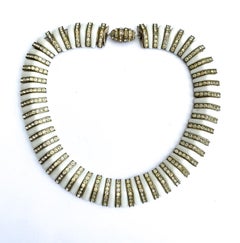 A white opaque glass and clear channel set paste collar/necklace, France, 1930s.