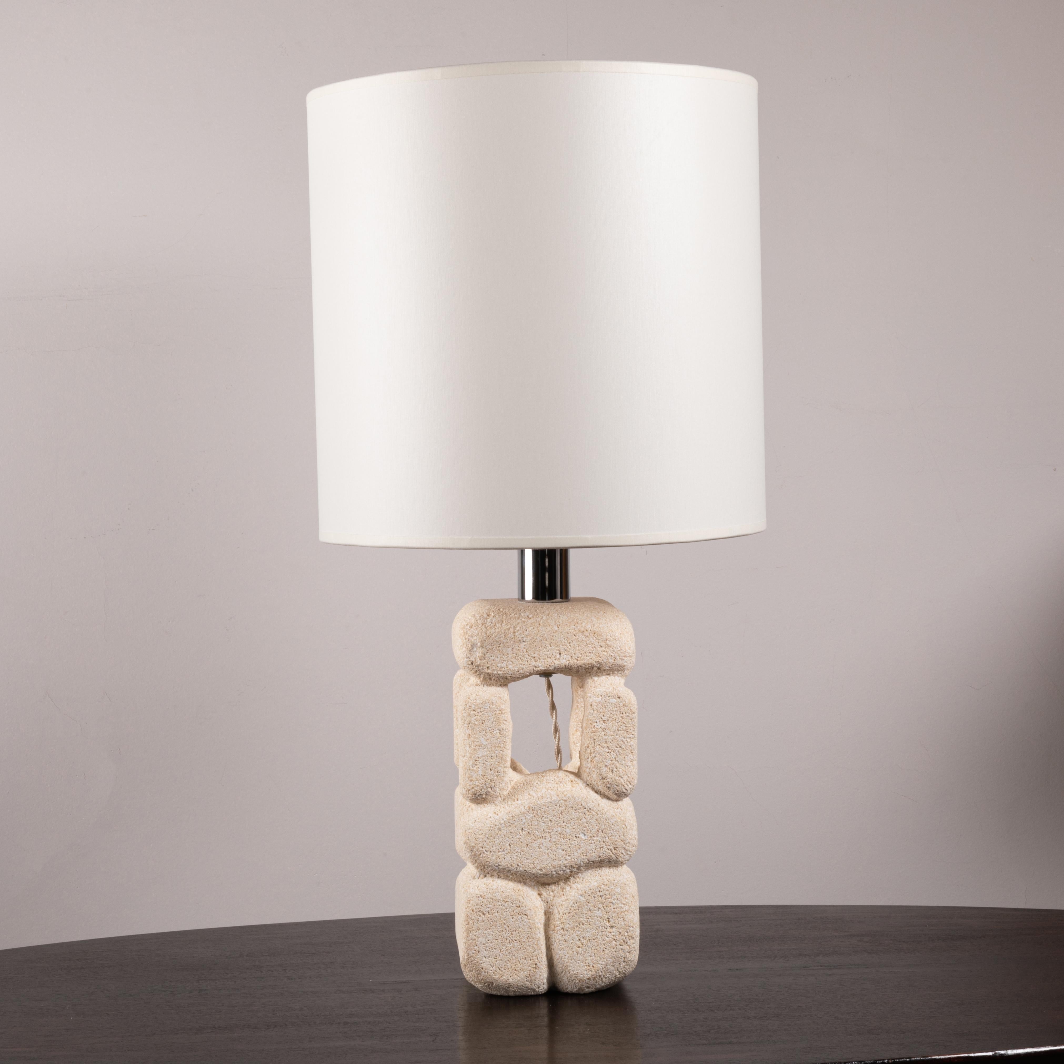 White stone table lamp by Albert Tormos. 
In a 