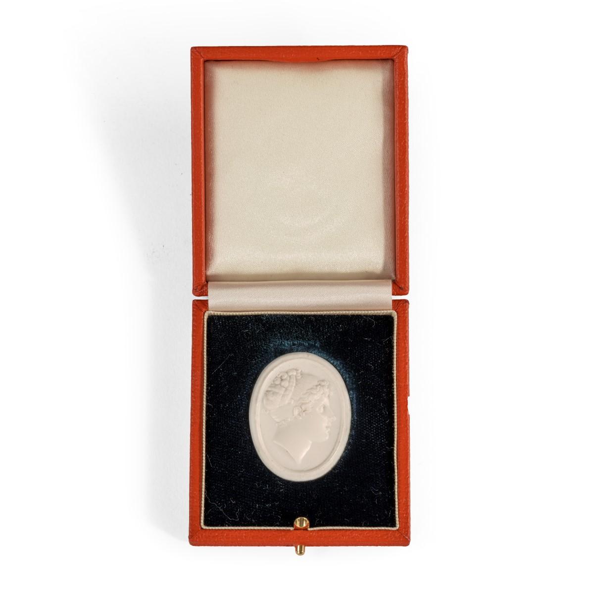 A white vitreous paste cameo of Emma, Lady Hamilton, attributed to William Tassie after Filipo Rega, of oval form depicting Emma facing right with her hair in a Grecian style, English, circa 1800

 

Footnote: William Tassie (1777-1860) was a