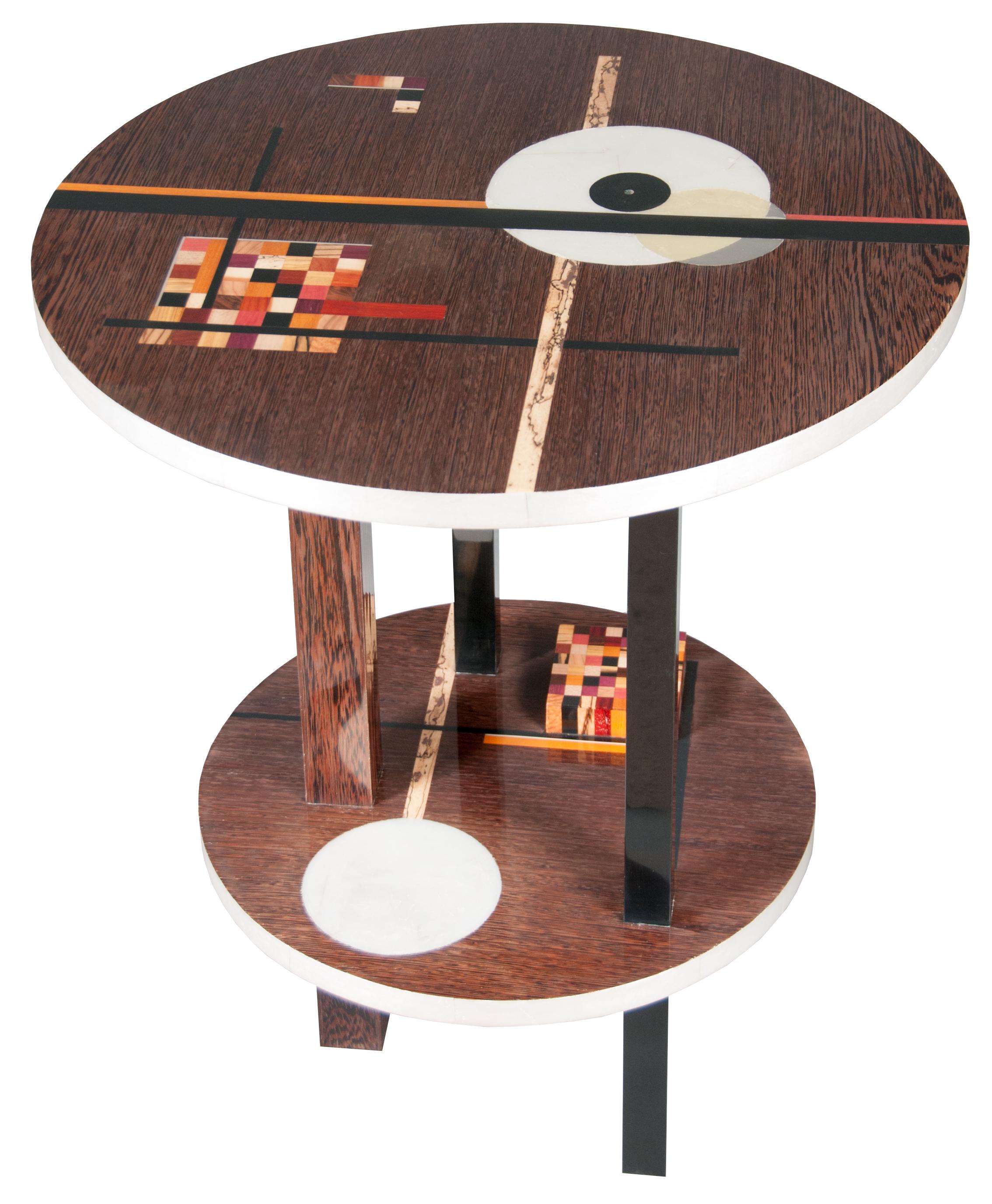 We created this occasional table first and foremost to be a well-crafted functional table with a distinctly sculptural sense of interplay between the rectilinear vertical support elements and the juxtaposition curvilinear horizontal elements.