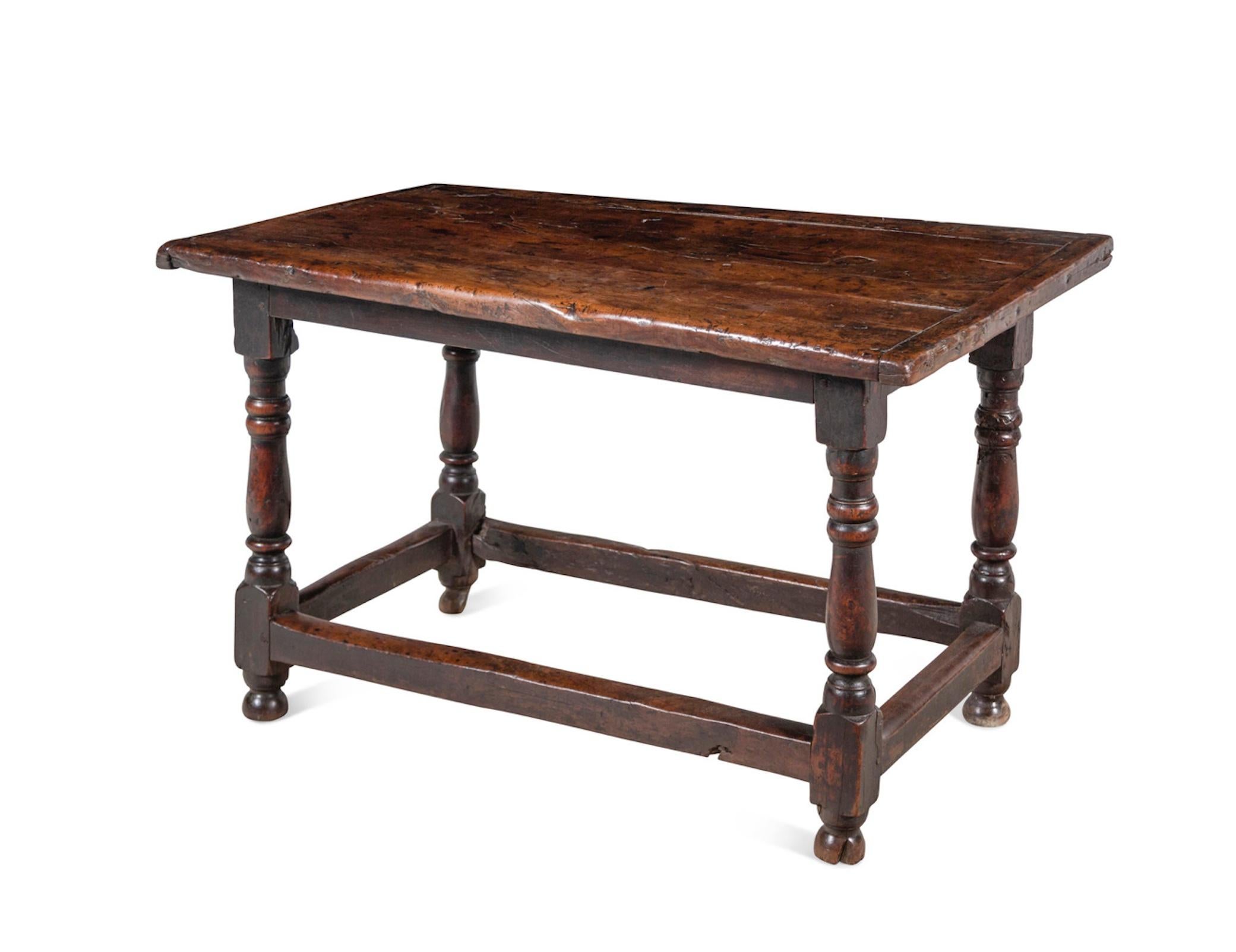 A William and Mary Walnut Table
17th Century
Height 29 x width 47 1/2 x depth 28 inches.