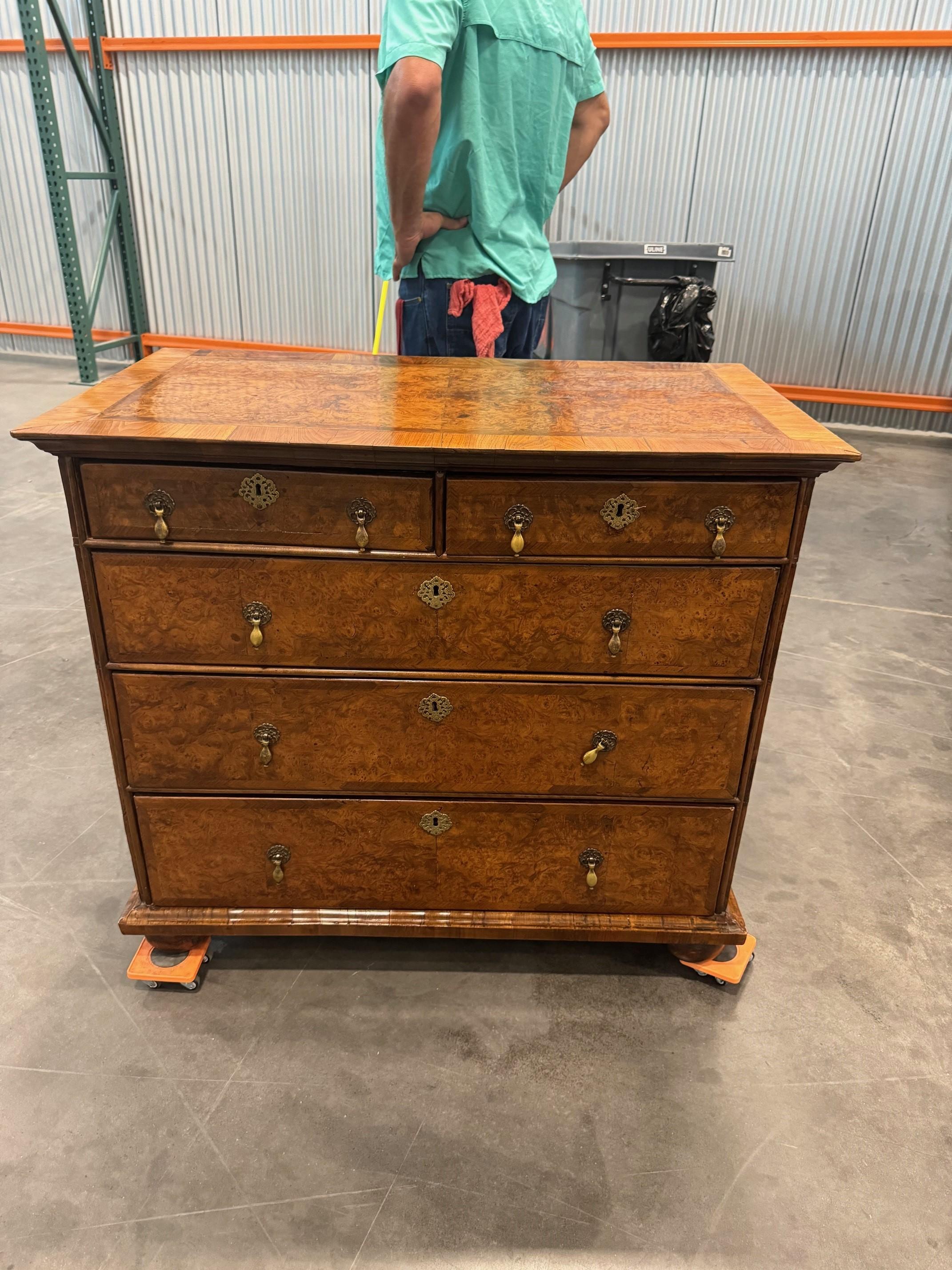 A Wonderful  Burr Walnut and Feather Banded Chest of Drawers CIRCA 1700  
with quartered feathered top and bun feet on bottom with two short over 3 long and drop handles absolutely wonderful coloring