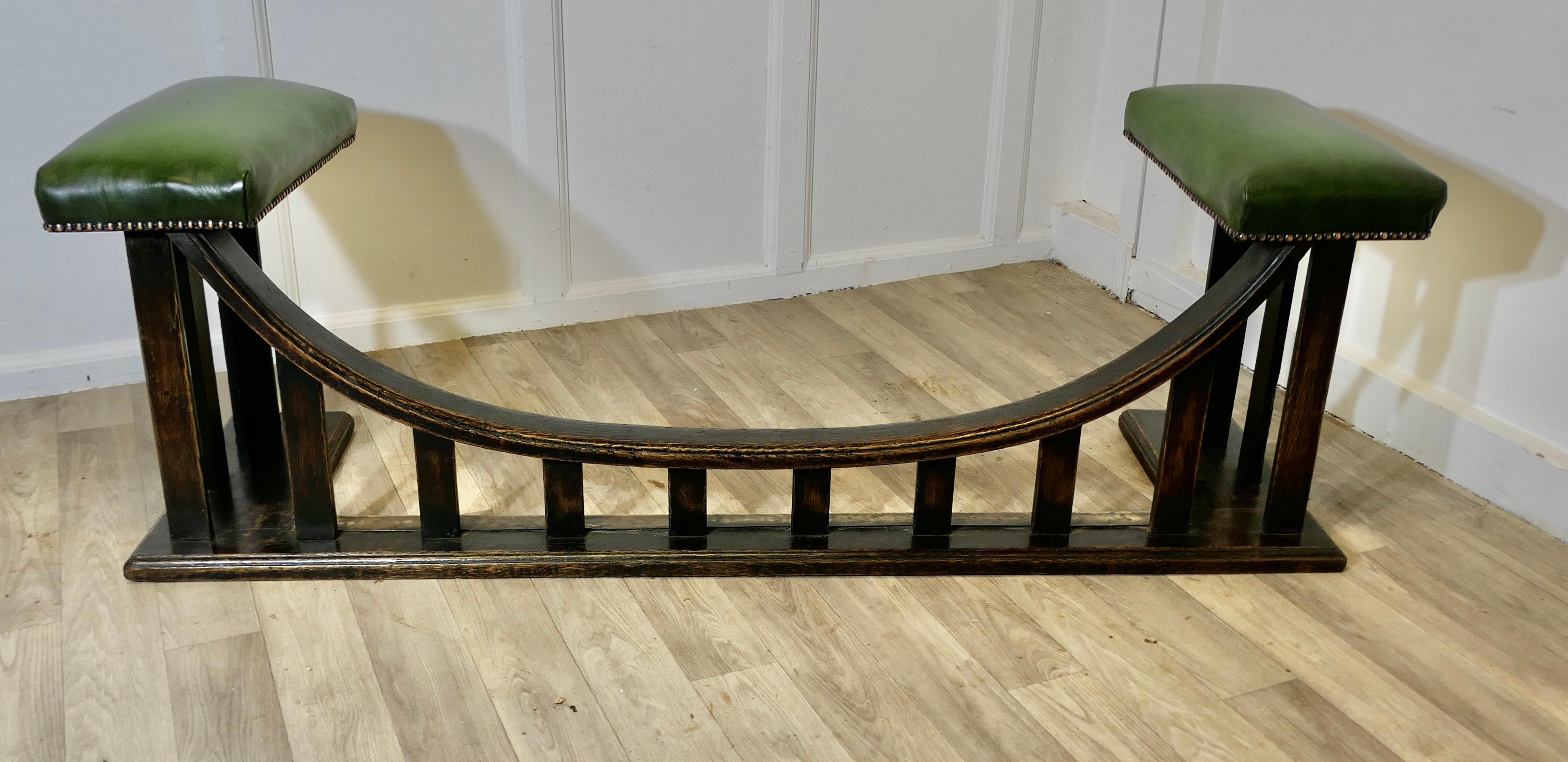 A William Birch Arts and Crafts Heavy Oak Club Fender

This very stylish Arts and Crafts Oak and Leather Club Fender was made around 1905 by William Birch for retail by Liberty & Co. Ltd.  
The fender is long with a curved low centre to access the