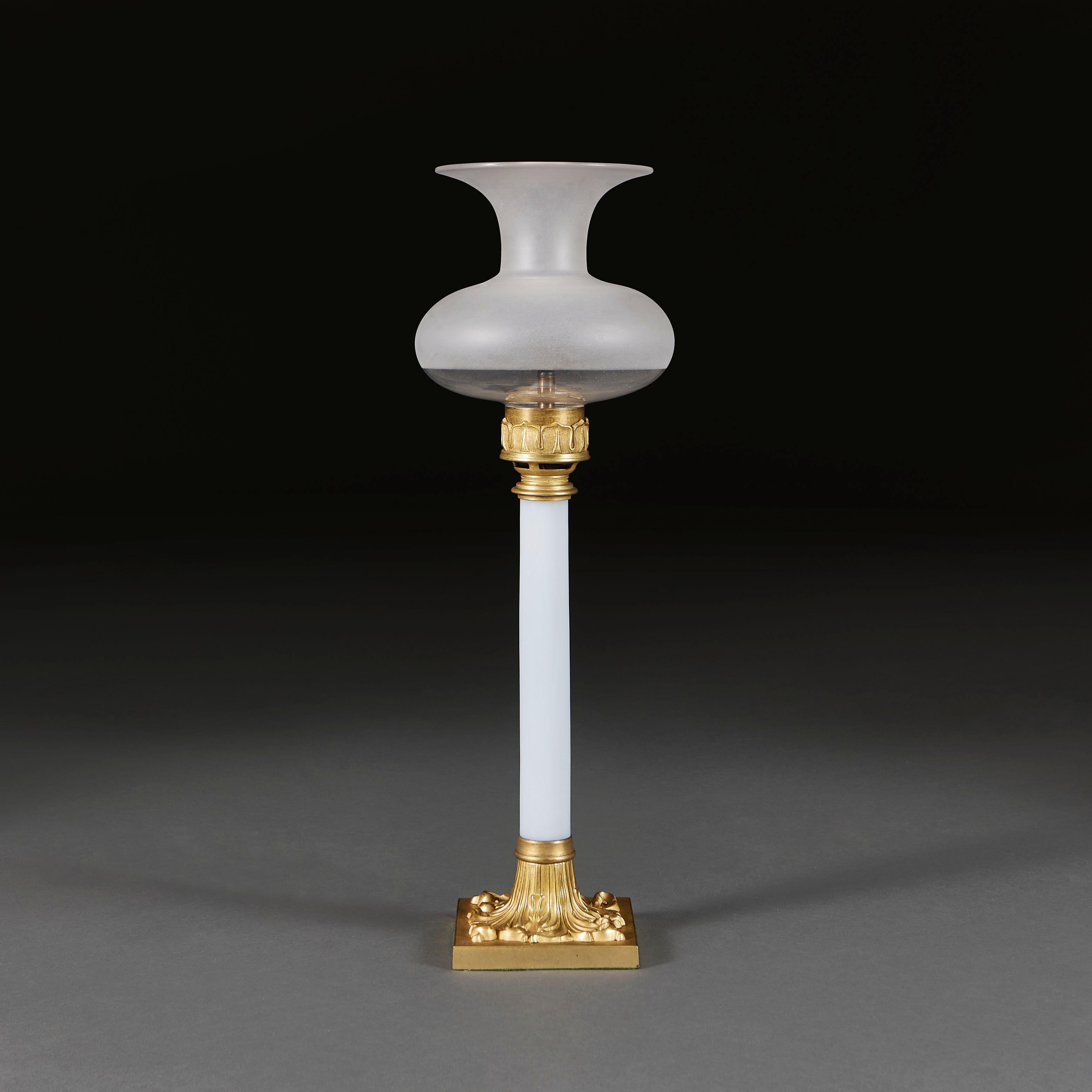 England, circa 1840

An unusual mid nineteenth century white opaline glass column lamp with gilt bronze mounts and unusual onion shaped cowl shade.

Total height 57.00cm

Width of base 13.00cm