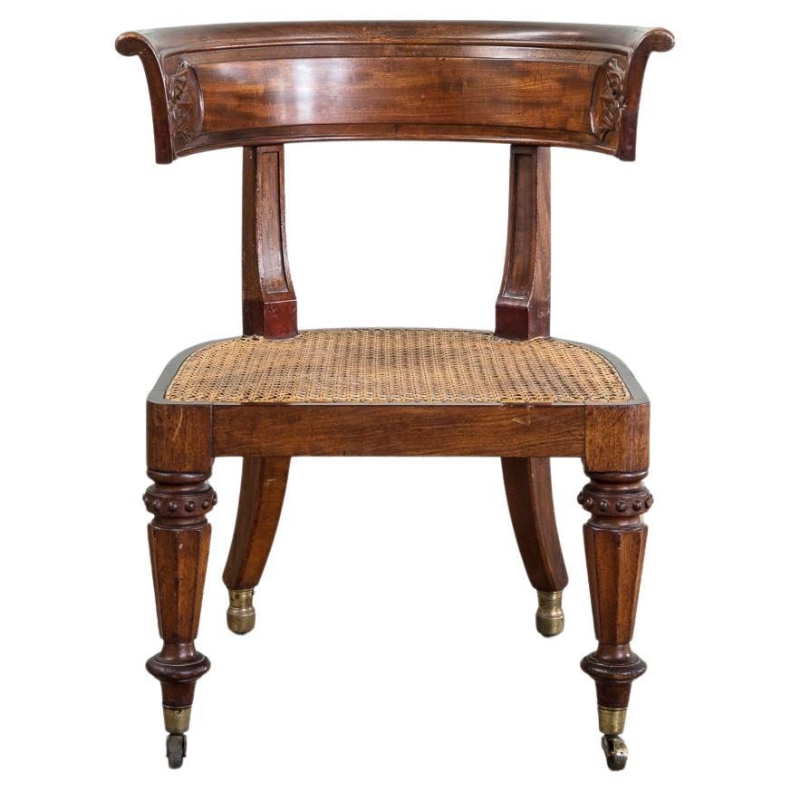 A William IV Carved Mahogany and Caned Library Chair