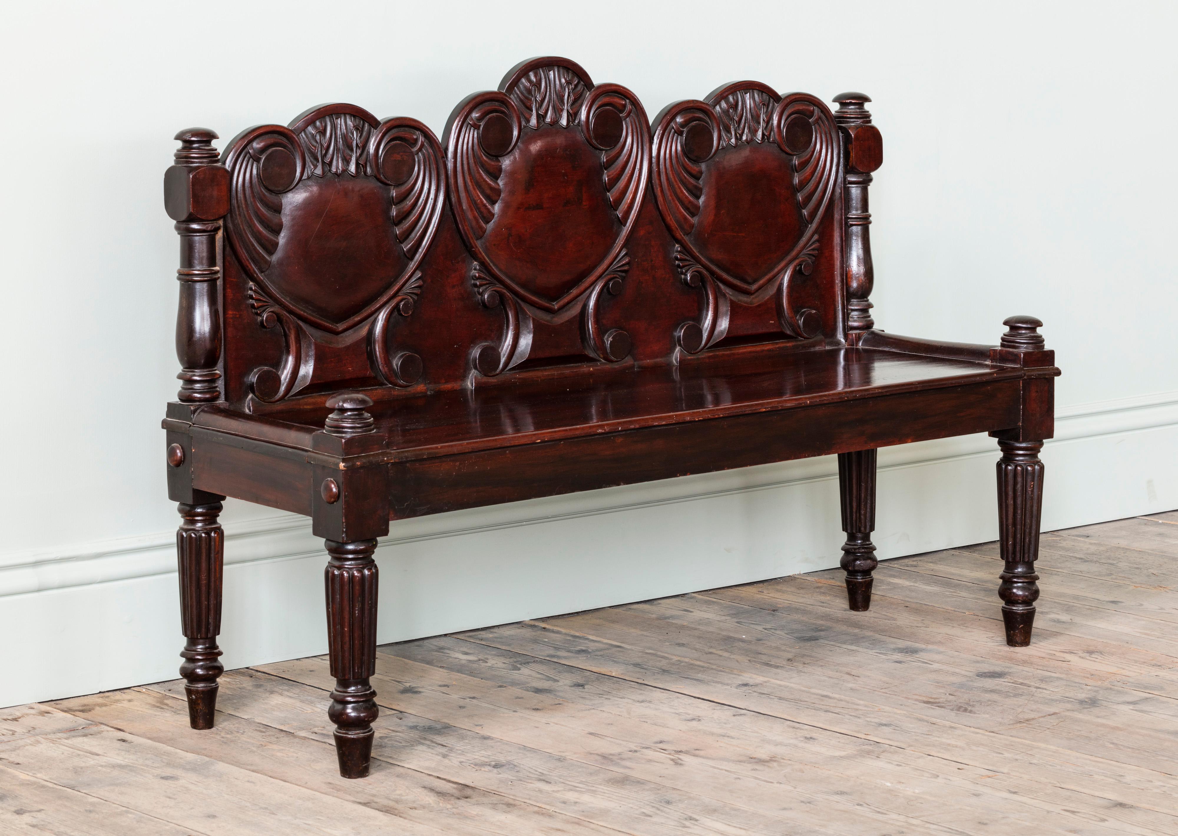 With three heart shaped & seat back motifs, on rectangular seat on reeded tapering legs.