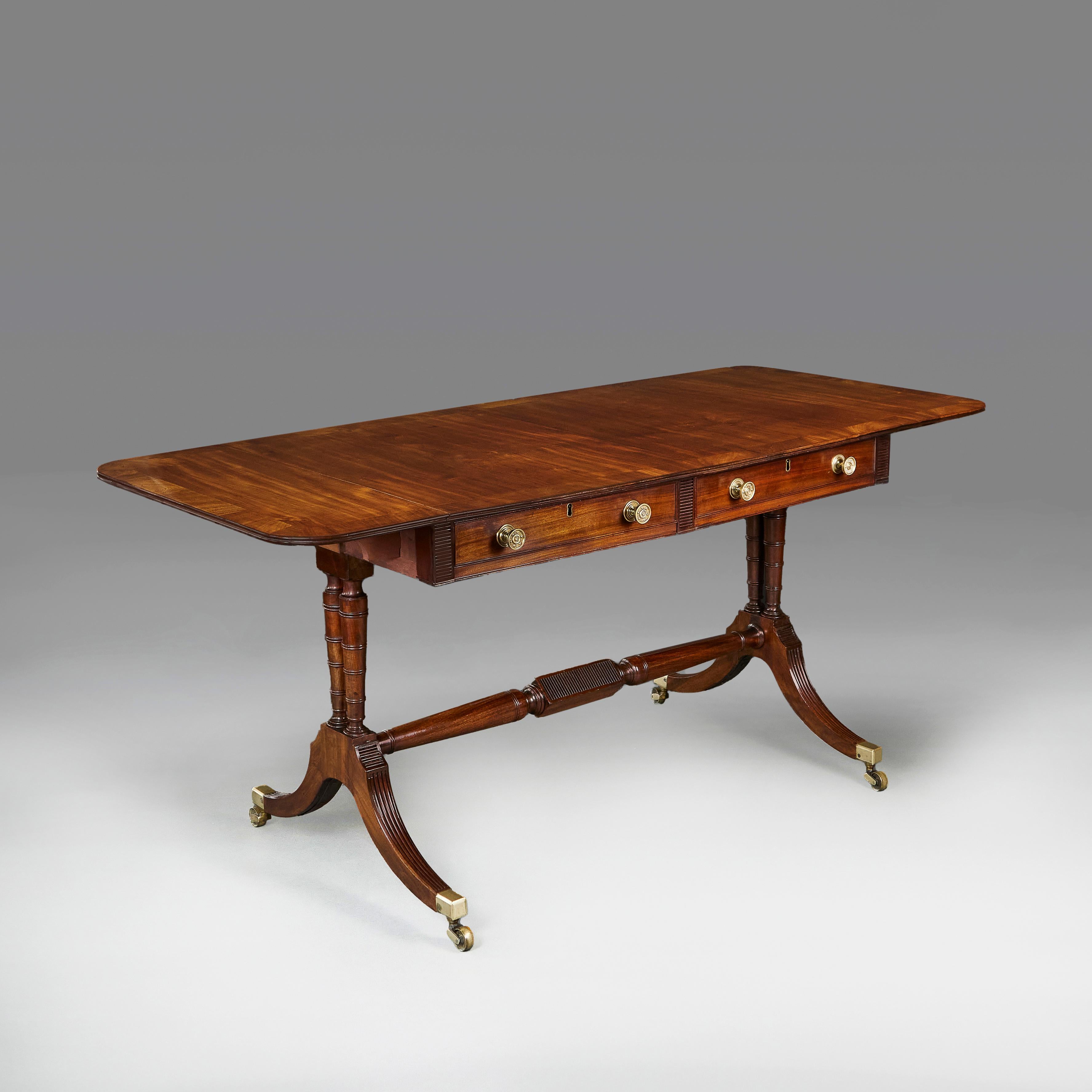A fine William IV mahogany sofa table, with two drawers to the frieze, with opening flaps to each side, all supported on out-splayed legs joined by a turned stretcher, the feet terminating in brass castors.
England, circa 1830
Height   71.00cm
Width