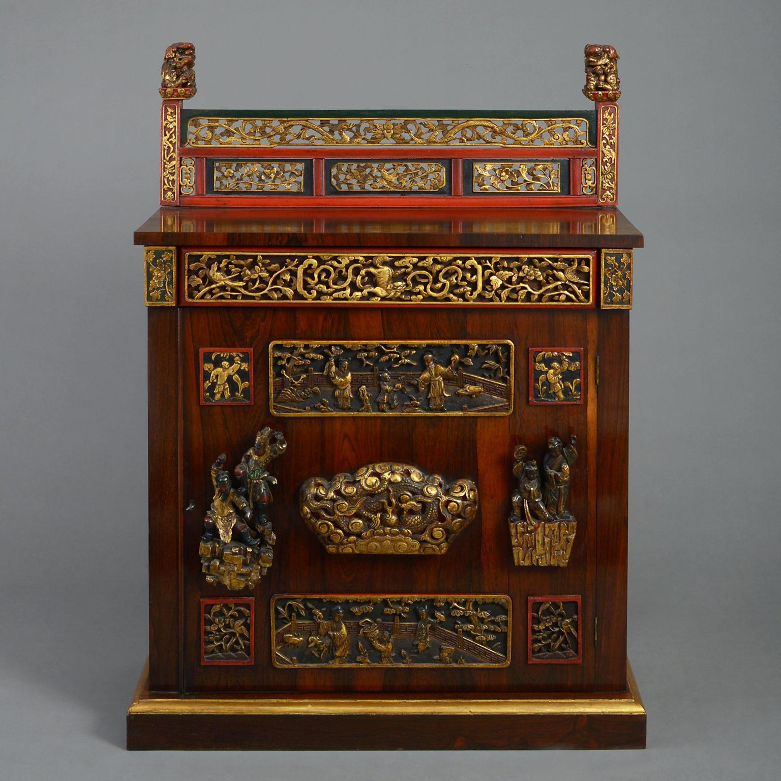 A William IV period rosewood cabinet, having a Chinese carved and painted parcel-gilt gallery and applied parcel gilt panels with a frieze drawer and the door enclosing a shelf.

Provenance: Miles Stapleton, 8th Lord Beaumont (1805-1854), thence
