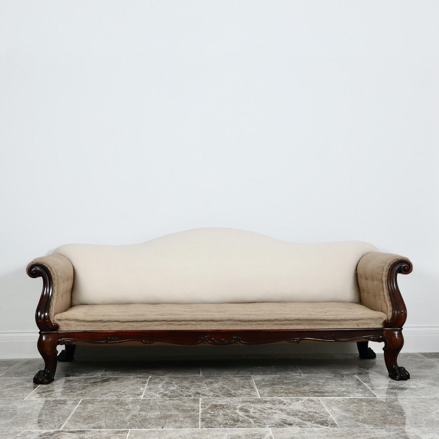 Vagabond antiques presents a 19th centry goncalo alves sofa

England, Circa 1835

” Attributed to Gillows, a large scale goncalo alves sofa with outcurved acanthus carved arm terminals, above a shaped foliate scrolled and rocaille seat frame, on