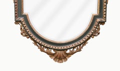 A William Kent Style Ebonized and Parcel Gilt Pier Mirror