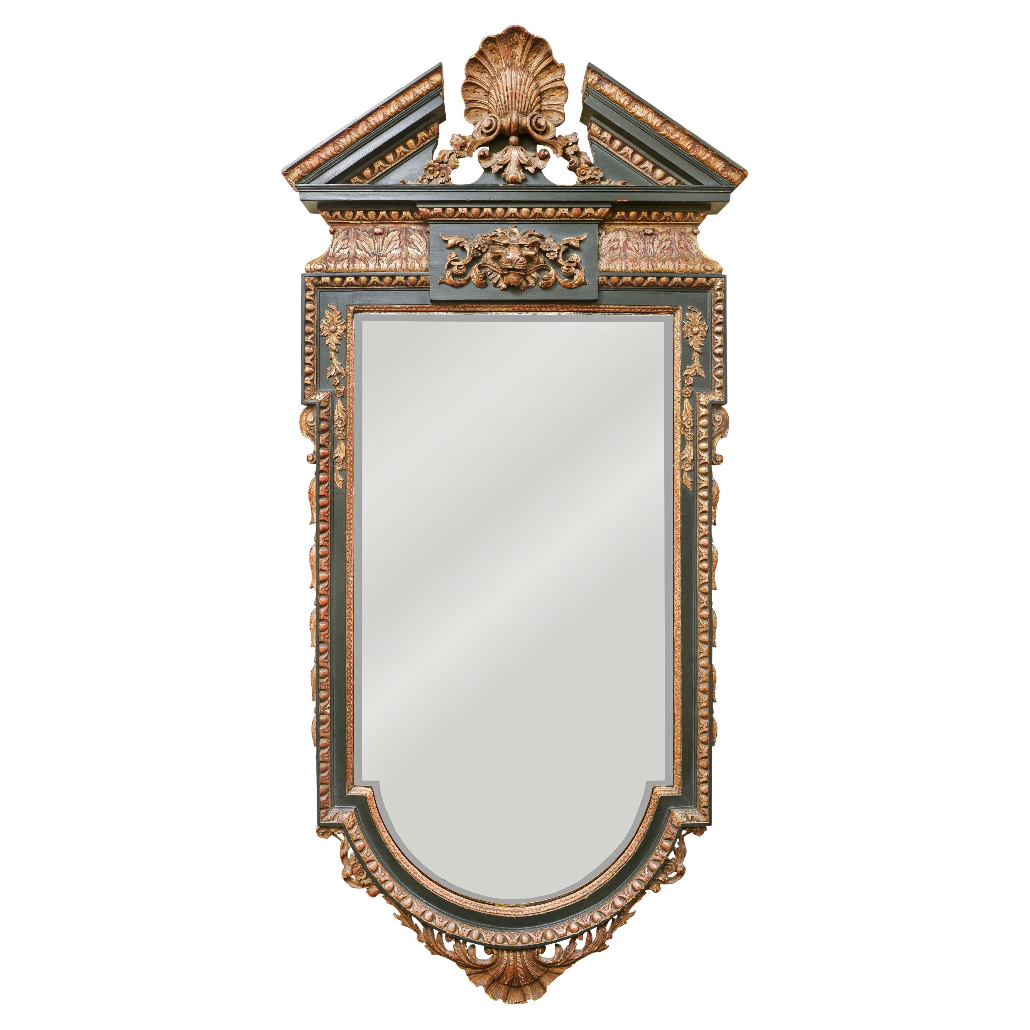 A William Kent Style Ebonized and Parcel Gilt Pier Mirror For Sale