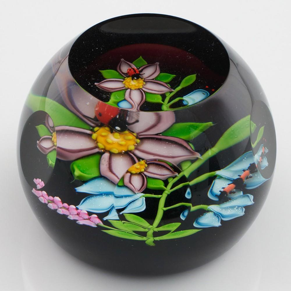 Heading : A William Manson Caithness Nature Study Limited Edition Paperweight 1988
Date : 1988
Origin : Scotland
Features : Lampwork flowers with ladybird and catepillar on a dark ground with facet cut windows
Marks : Caithness Nature Study Scotland