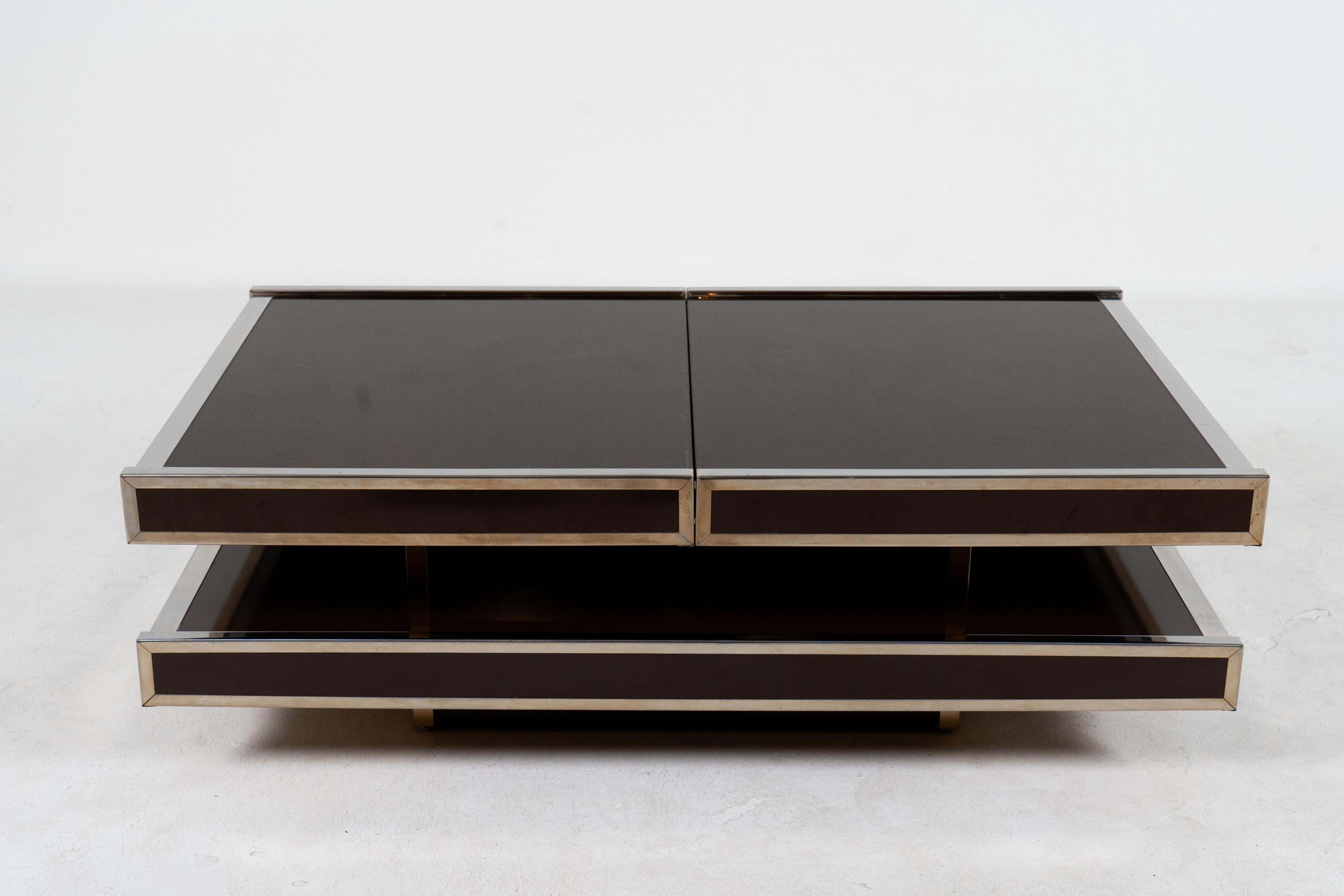 A sophisticated Italian Midcentury Modern cocktail table and dry bar by Willy Rizzo. The table captures the glamour of 1970's design with its low, sleek, polished aesthetic. Furthermore, it is highly functional as it expands to accommodate a large