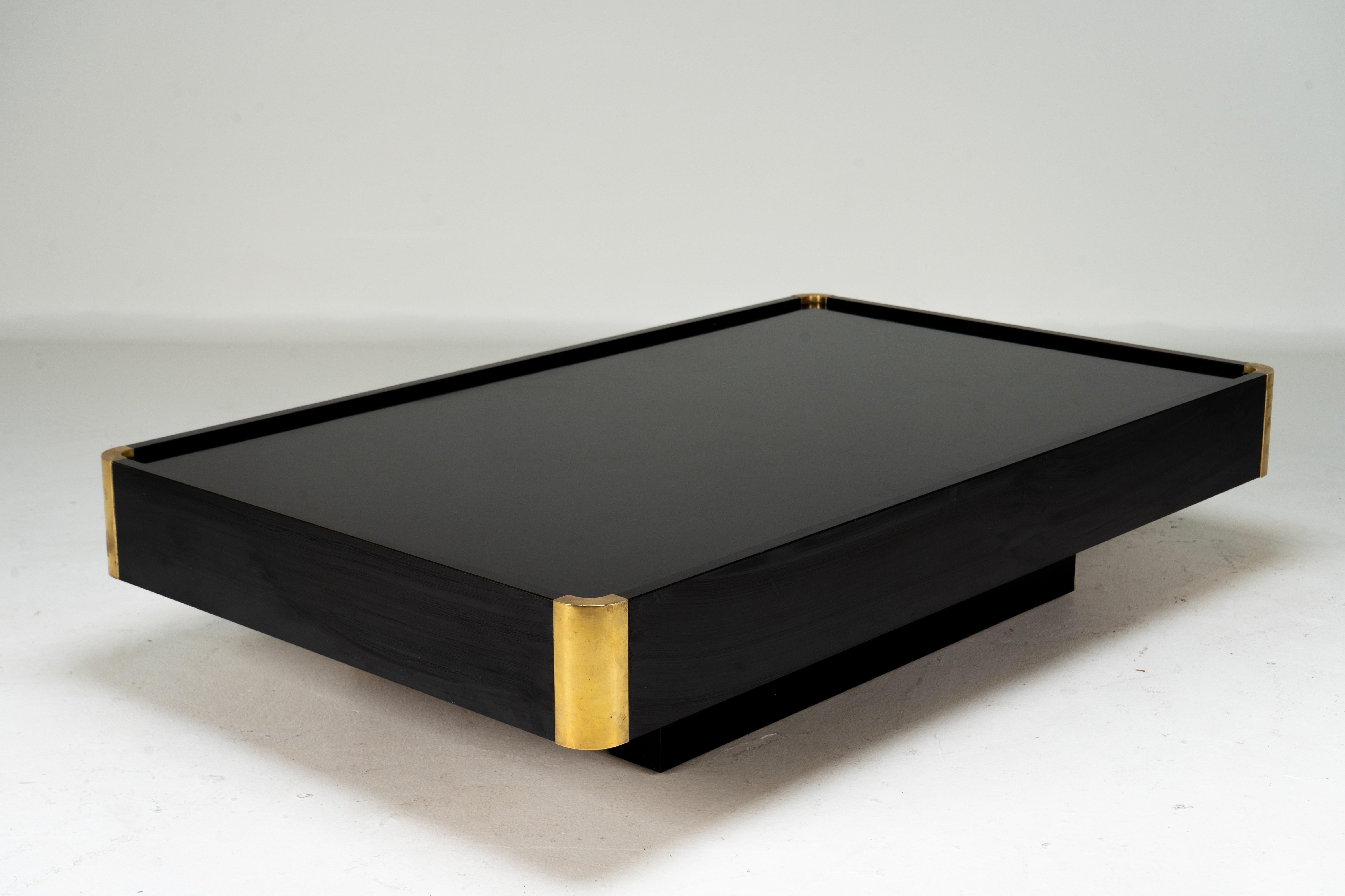 A sophisticated Italian Midcentury Modern cocktail table by Willy Rizzo. The table captures the relaxed glamour of 1970's design with its low, sleek, aesthetic. The piece is made from chrome-coated steel and wood-colored resin inserted in the top.