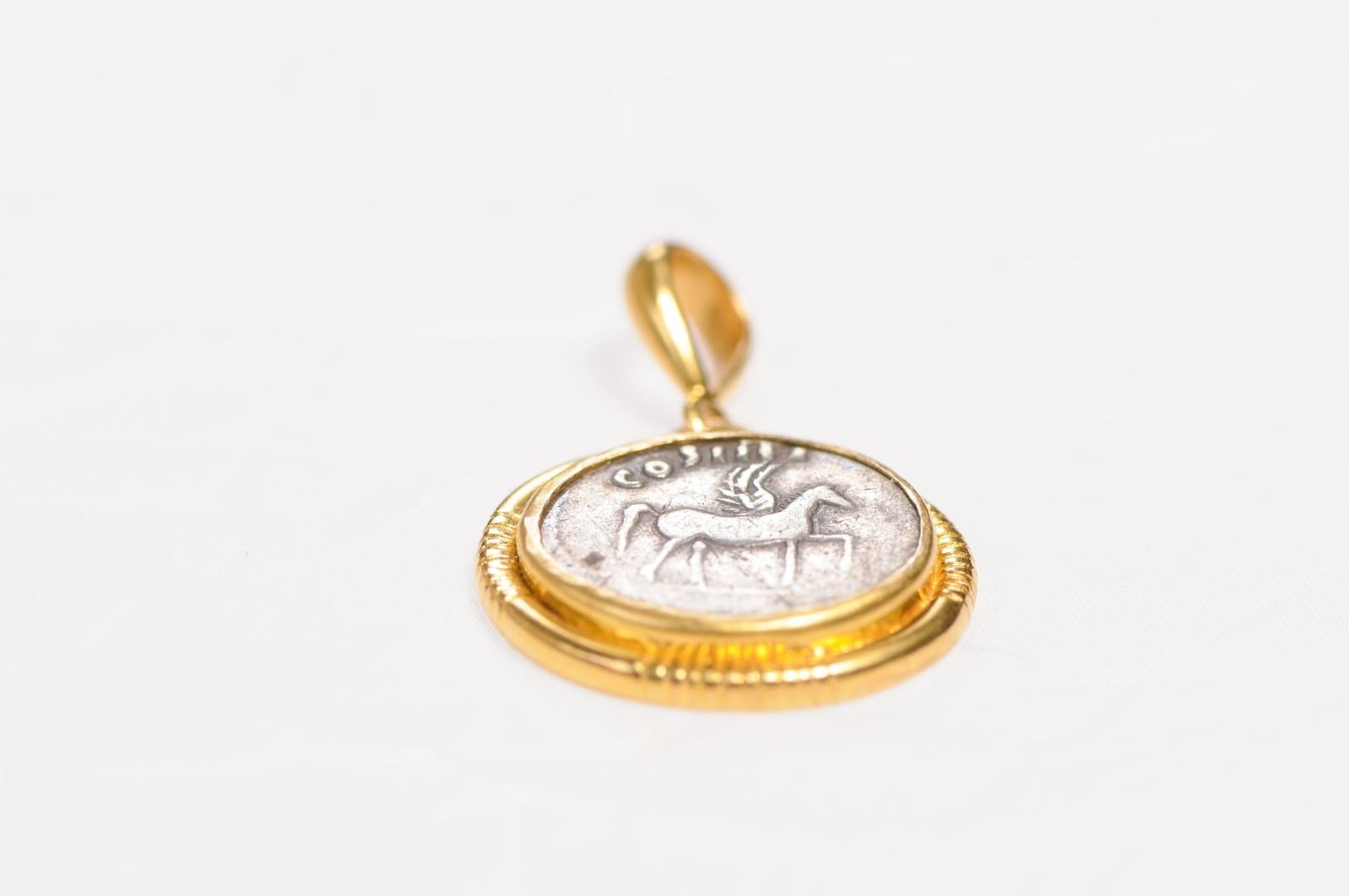 A Winged Pegasus Coin in 22kt Gold Pendant In Excellent Condition For Sale In Atlanta, GA
