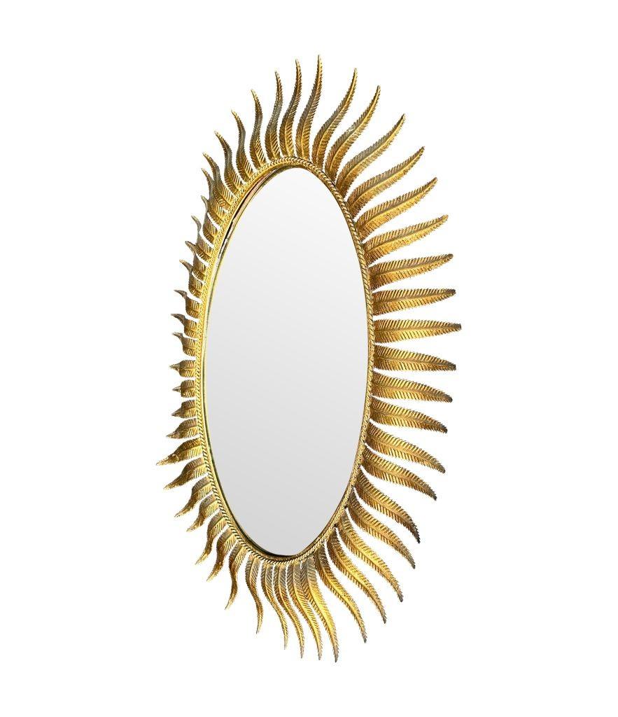 A wonderful 1950s gilt metal oval Spanish sunburst, eyelash mirror In Good Condition For Sale In London, GB