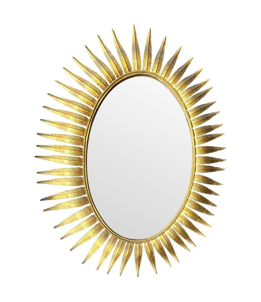 Mid-20th Century A wonderful 1950s gilt metal oval Spanish sunburst, eyelash mirror For Sale