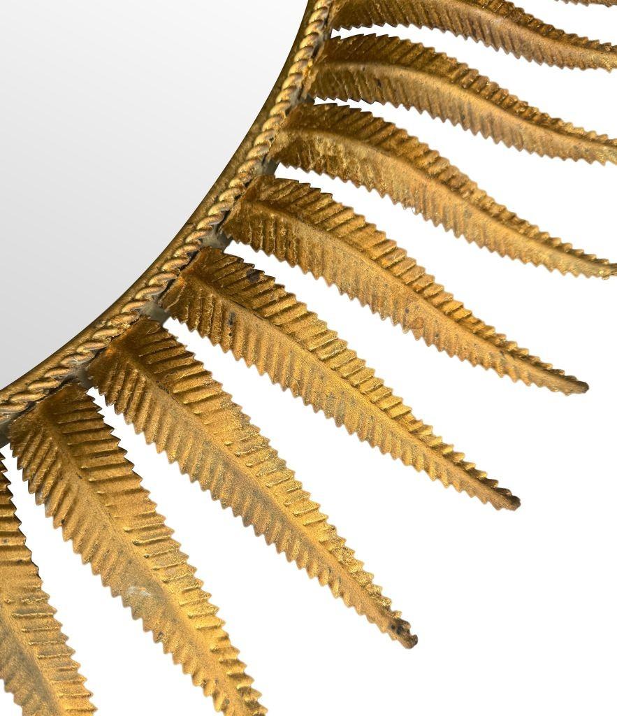 Metal A wonderful 1950s gilt metal oval Spanish sunburst, eyelash mirror For Sale