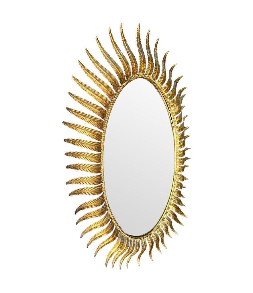 A wonderful 1950s gilt metal oval Spanish sunburst, eyelash mirror For Sale 3