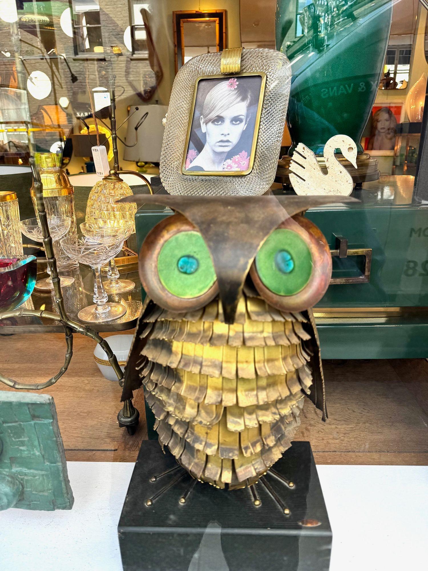 A wonderful 1966 torch cut brass Curtis Jere owl, with green enamelled eyes. With lovely orignal patina and mounted on an ebonised black base with original metal label 
