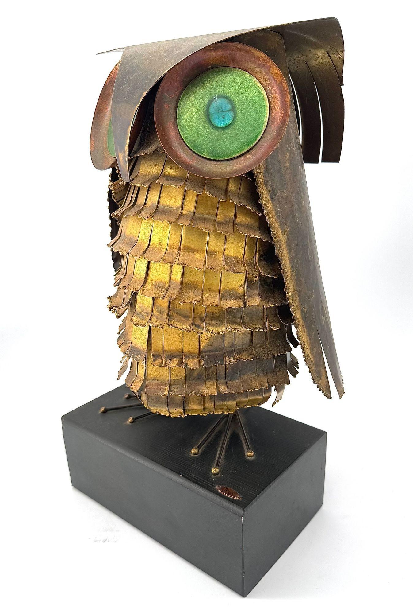 Central American A wonderful 1966 torch cut brass Curtis Jere owl, with green enamelled eyes.
