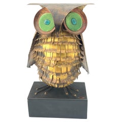 A wonderful 1966 torch cut brass Curtis Jere owl, with green enamelled eyes.