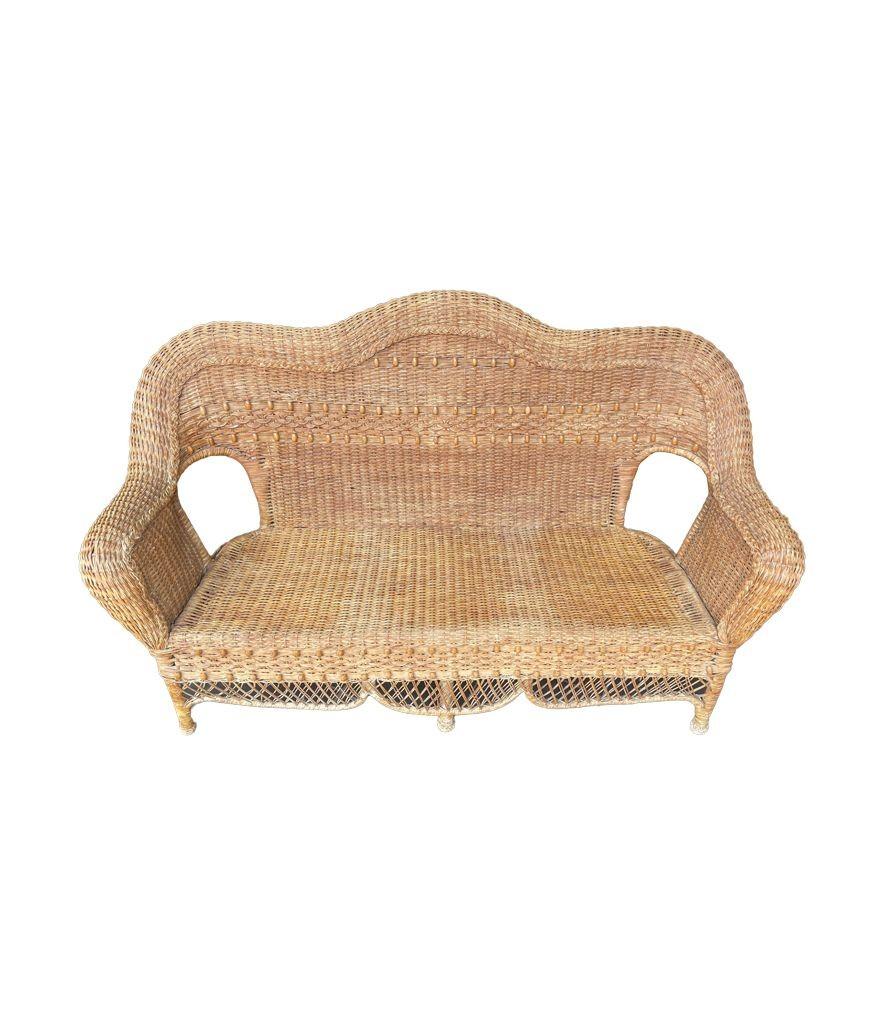 A wonderful curvaceous 1960s woven wicker and wood sofa with beaded detail For Sale 3