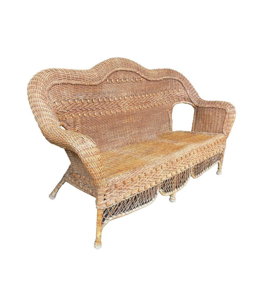 A wonderful curvaceous 1960s woven wicker and wood sofa with beaded detail For Sale 2