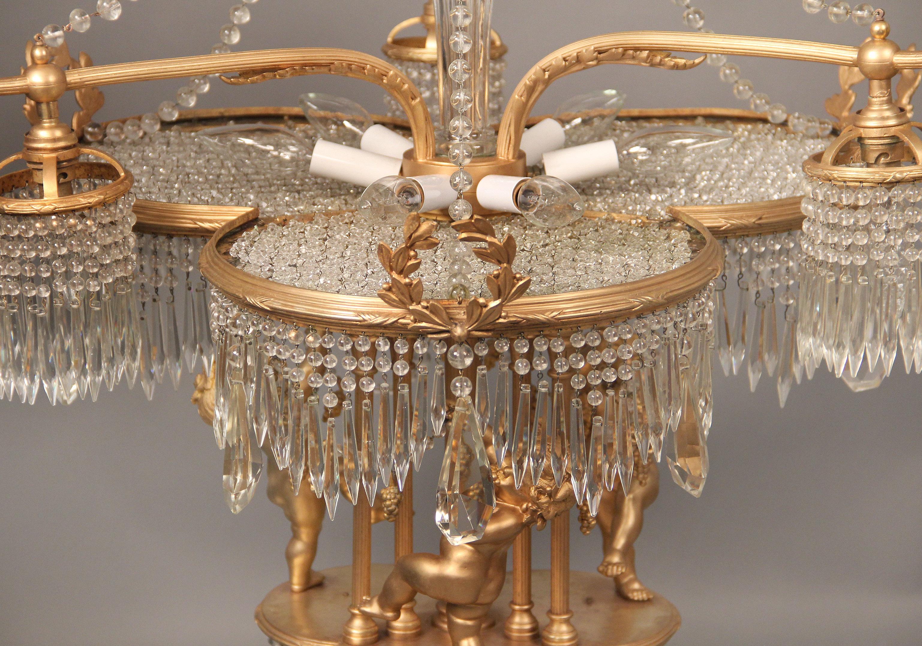 Doré Magnifique lustre à dix-huit lumières en bronze doré et cristal du début du XXe siècle en vente